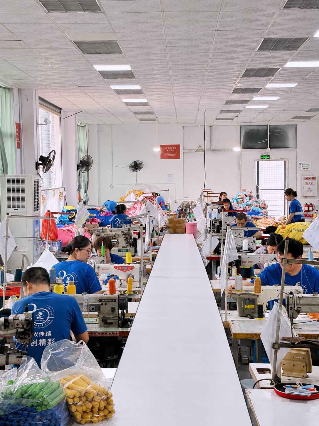 Huatop sewing production area with workers making neoprene products